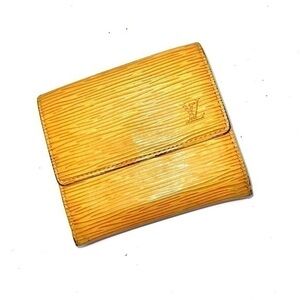 AUTHENTIC Louis Vuitton Marco Wallet. Color: Tassel yellow.